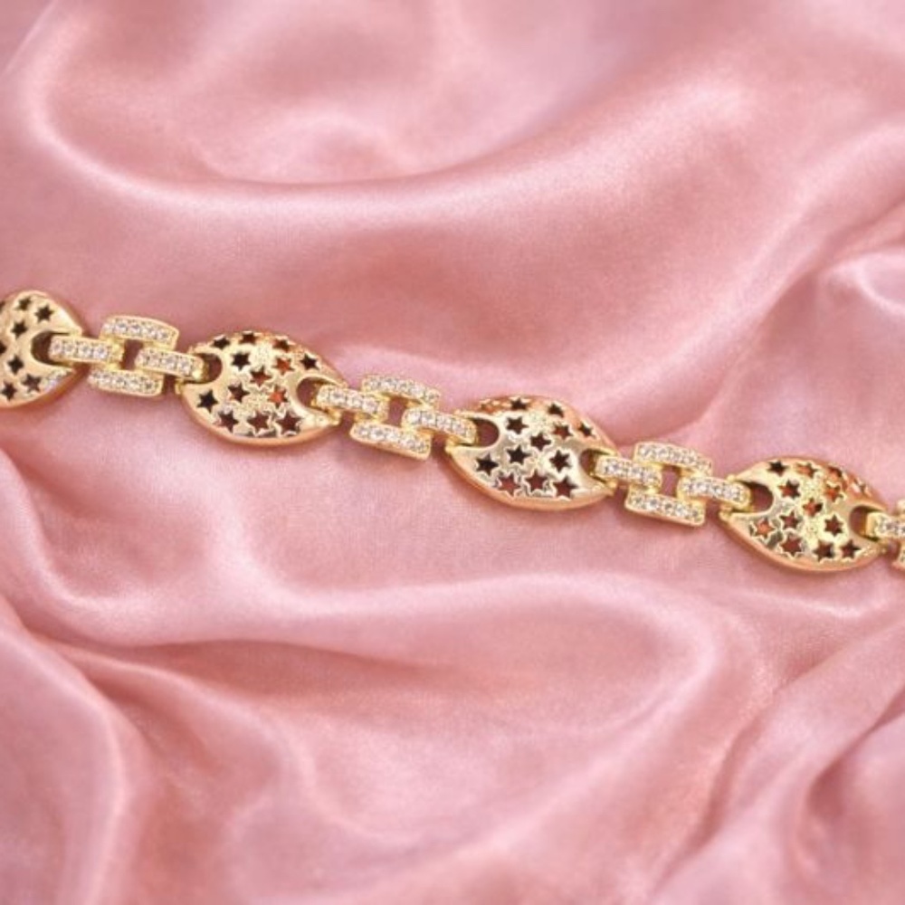 14k gold bracelet with pounded hammer design and pave' stone setting